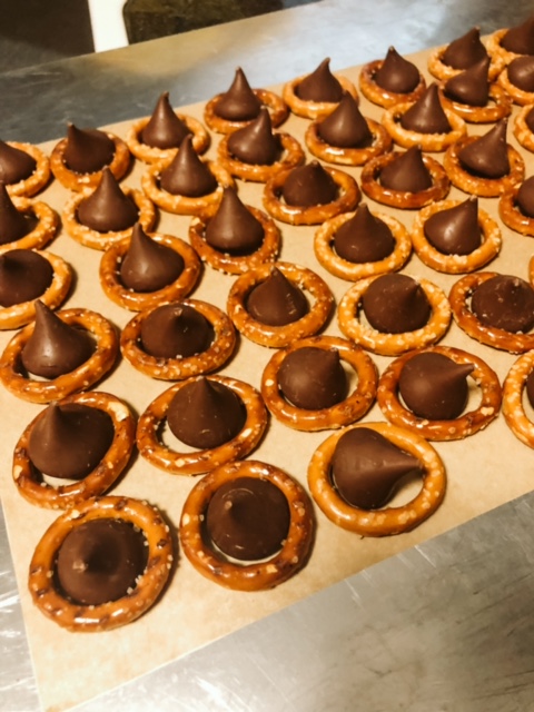 Pretzel rings with Hershey Kisses in the middle.
