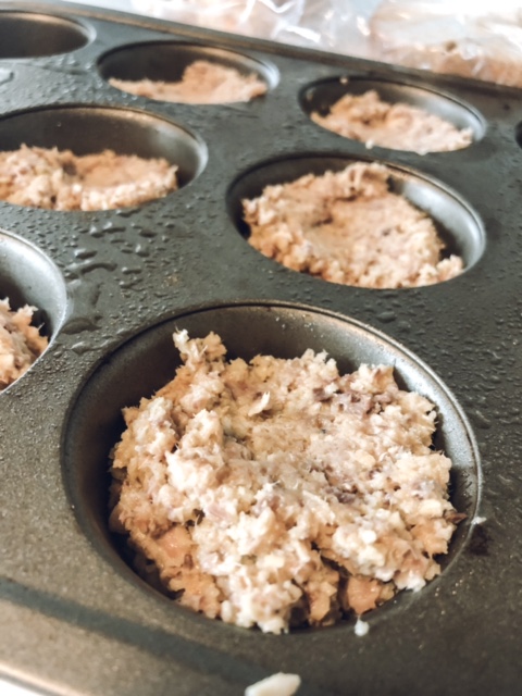 Scoop the raw ingredients into the muffin pan.